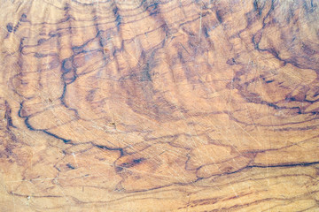 Old shabby chopping board with a soft focus view from the top, vintage, scratched, used                   