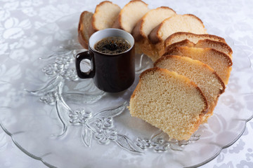 Slices of cake and a cup of coffee on a plate on a table