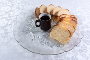Slices of cake and a cup of coffee on a plate on a table