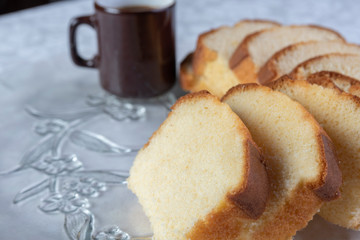 Slices of cake and a cup of coffee on a plate on a table