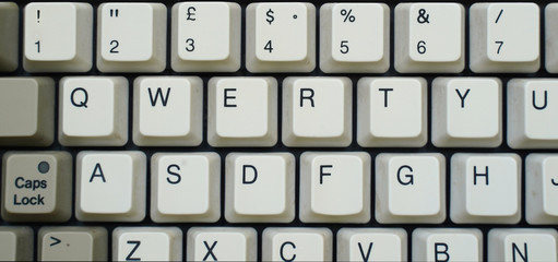 detail of a old keyboard, vintage 90 ', qwerty, without background               