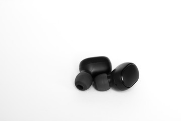 Closeup of black and white wireless headphones isolated on white background