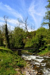 Fototapeta premium a wooden bridge over the river