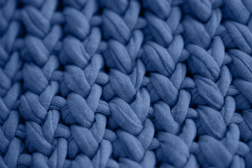 A fragment of a classic blue knitted basket. The trend of color by 2020.