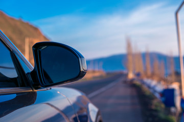 a blue car mirror in the yard