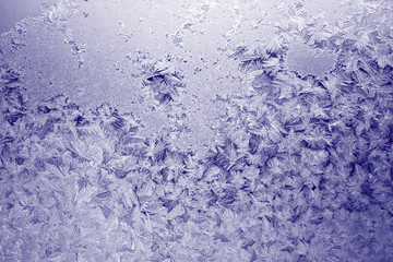Fototapeta na wymiar Winter texture of frost on the glass window as a background.