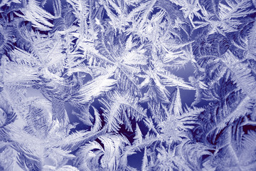 Winter texture of frost on the glass window as a background.