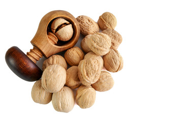 Whole and cracked walnuts isolated on white background