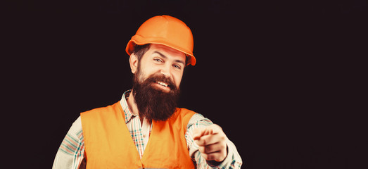 Man builders, industry. Builder in hard hat, foreman or repairman in the helmet. Bearded man worker...