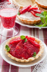 Blood Orange Tartlets. Homemade Pie Crust Filled with Whipped Cream and Fresh Citrus