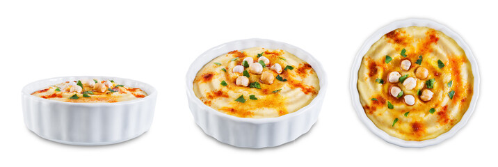 Hummus appetizer in a white bowl on a white isolated background