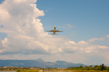 Take off plane in the sky on sunny day with clouds