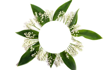 Blooming lilies of the valley in the form of a round frame isolated on white background with copy space. For website design.