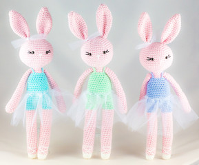 Amigurumi. Handmade crotchet rabbits. - obrazy, fototapety, plakaty