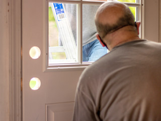 Fototapeta premium men replacing door; repair and construction on door frame