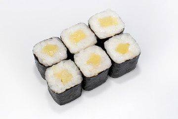 Japanese traditional roll with rice, nori, pickled daikon takuan on a white background