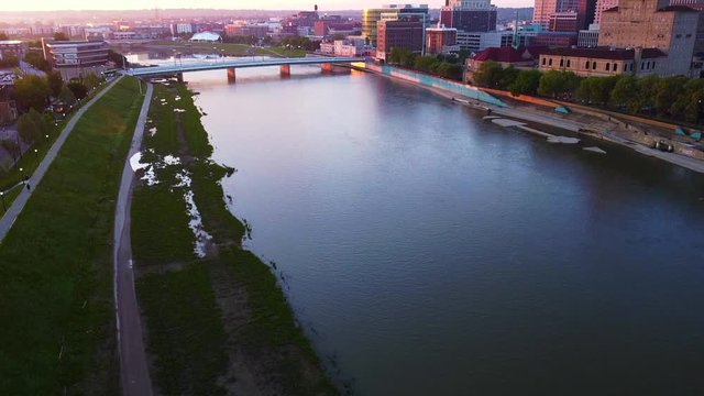 Ariel footage of dayton from drone panning up to city during sunrise. Beautiful colorful morning