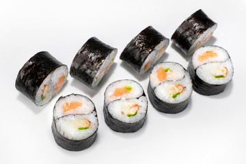 Japanese roll of rice, nori seaweed, salmon, eel and green onions on a white background