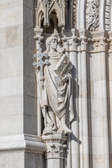 Fototapeta na wymiar Limestone statue outside soutside entrance of Hungarian Parliament in Budapest