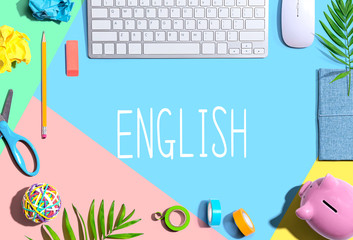 Learning English concept with office supplies and a computer keyboard