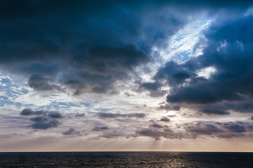 Naklejka na ściany i meble Stormy sky over dark sea. HDR image with copy space