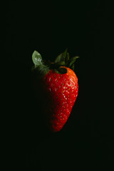 strawberry over dark background