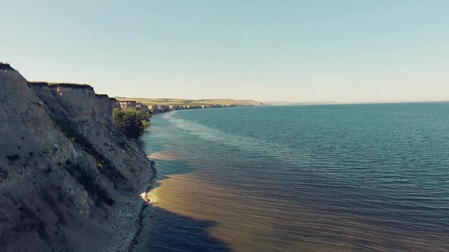 Flying along the edge of a cliff