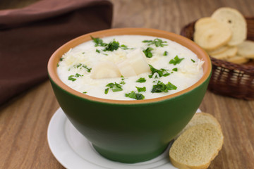 Palm heart soup in wood background