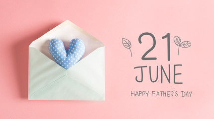 Father's Day message with a blue heart cushion in an envelope