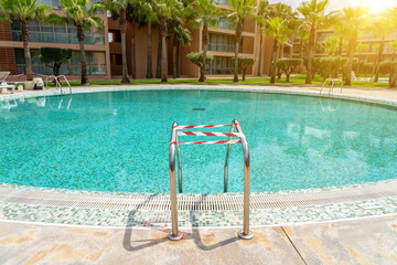 The pool on a sunny day, during the coronavirus, located on the territory of the hotel, wrapped in...