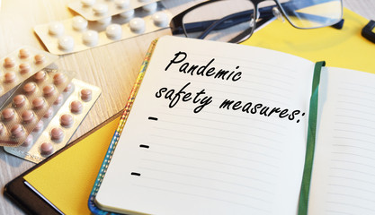 The inscription on the blackboard with the background of pills on the medical table: healthcare...