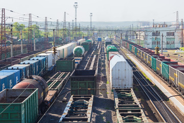 Fototapeta premium Cargo junction of the railway track. Freight wagons are on the railway.