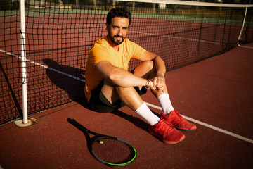tennis player sitting and smiling