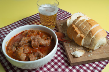 tasty and tradicional brazilian snack bar: gizzard, bread and cold beer.