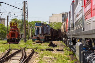 Ussuriysky Locomotive Repair Plant. An old locomotive car is being repaired in a railway depot