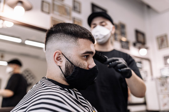 Men's haircut in a barbershop. Styling and hair care. 