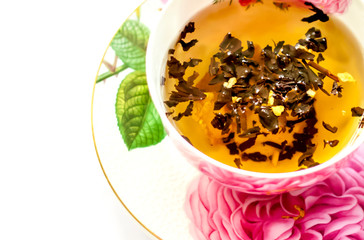 Cup of tea. Large tea leaves in a Cup. Large-leaf tea with fruit. Tea party.