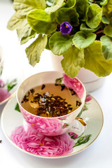 Cup of tea. Large tea leaves in a Cup. Large-leaf tea with fruit. Tea party.