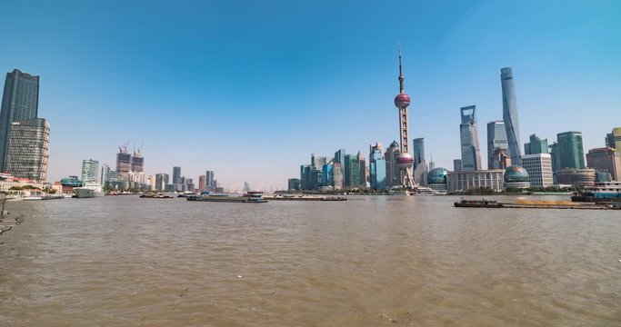 Shanghai, China, Time-lapse of the boats on Huangpu River with the city skyline in the background. *Includes 2 static clips and a digital pan of each using full resolution of image.