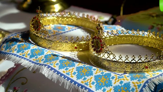 Gold crowns are on the altar. Two Orthodox Wedding Ceremonial Crowns