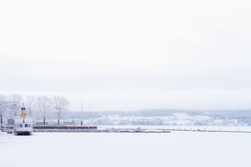 Fototapeta na wymiar Winter in Östersund: snow on the frozen Storsjön lake