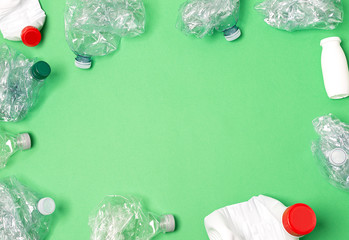 Recycled materials on a green background view from above