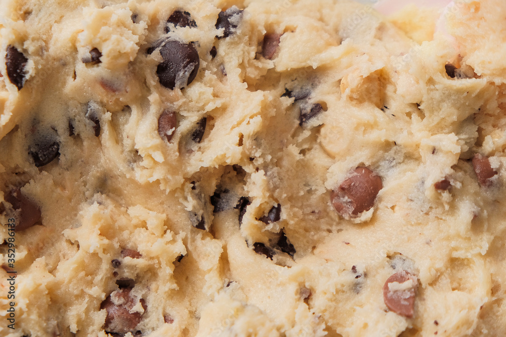 Wall mural macro shot of chocolate chip cookie dough. the process of cooking a family recipe. dark and milk cho