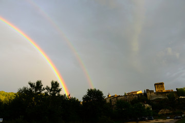rainbow over Beautiful small village Montclus in Department Gard in Southern France