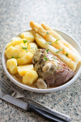 Beef steak with mushroom sauce & baby potatoes & white asparagus
