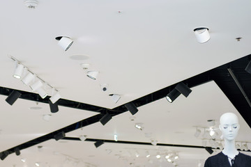 Modern white and black ceiling in the store and mannequin