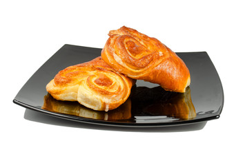 Two sweet sugar buns on a white background