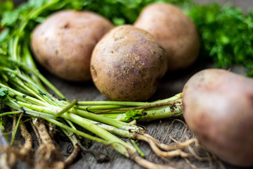 potatoes and green vegetable on the table