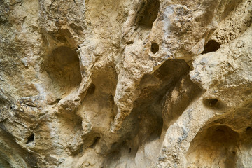 The texture of the stones. The stone splits. Rocks in the section. Tiles and mountains. The Wallpaper is grey.