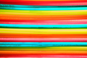 Abstract background of multi-colored horizontal child stripes, close-up